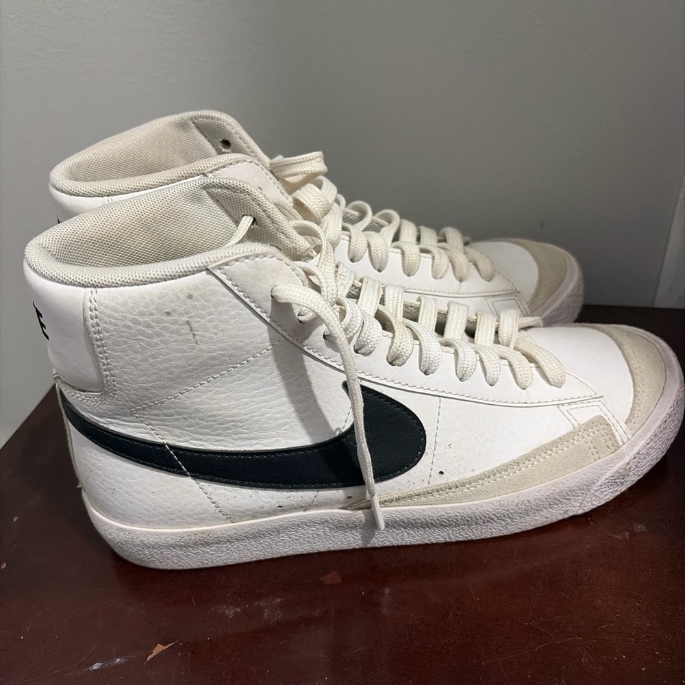 Nike White High-Top Sneakers with Black Swoosh